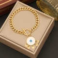 Golden Evil Eye bracelet with T-bar clasp and blue charms on a jewelry box - 2# Bracelet
