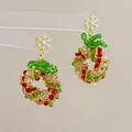 Macro detail of handmade beaded Christmas wreath earrings with gold snowflake studs - Snowflake Christmas Wreath-Silver Pin / Stud Earrings