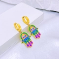 Golden Hamsa hand drop earrings with colorful enamel eye design and hook closure - Earrings