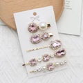 Set of 5 pink rhinestone and pearl hair clips with gold base on a jewelry card - Pink