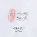 Detalle de dijes de lazo de esmalte azul 9x7mm con bordes dorados para manicura DIY - Lazo de Borde Dorado Azul (8462)