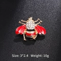 Cute little bee brooch pin in gold alloy with red enamel wings and sparkling crystals - Full Red Rhinestone Bee