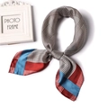 Elegant silk scarf featuring classic houndstooth patterns with red and blue color blocking - Blue Red Border