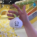 Cute white plush garlic keychain pendant with green leaves and sad facial expression - Garlic + Silver Buckle
