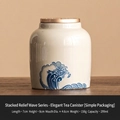 Mini cream ceramic tea canister with blue wave relief and gold lid for loose tea - Relief Sea Wave Series - Elegant Jar