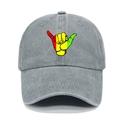 Detailed front view of grey washed denim baseball cap with colorful Shaka gesture print - M (56-58cm) / Light Gray