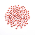 Detailed view of 8mm white heart-shaped acrylic beads with red stripes for DIY jewelry - Striped Heart