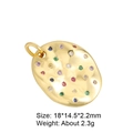Close-up of golden oval textured pendant with colorful zircon stones and size details - Oval Pendant