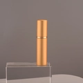 Portable 10ml golden aluminum perfume spray bottle with glass inner container on pedestal - 10ml / Gold