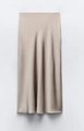 Elegant champagne satin midi skirt with high waist and smooth pearlescent silk texture - XS / Champagne