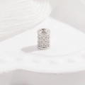 Macro view of S925 sterling silver barrel bead with three rows of micro-pave zircons - 4.5x6mm / White K Large Size