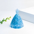 Macro detail of a blue resin princess dress ornament with embedded glitter and quartz stone - Aquamarine