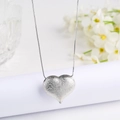 Macro shot of silver heart pendant featuring a textured frosted surface and elegant box chain - Large (30mm) / Silver