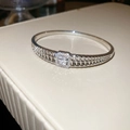 Macro shot of silver-plated bangle featuring double-row hollow chain and pavé zircon stones - Hollow Chain Rectangular Decor / Silver