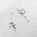 Detailed view of silver alloy gymnast charms on white fabric for DIY bracelet making - 1Pc Gymnastics Team 10x30mm