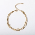 Detail of double-layer gold chain bracelet with irregular wave links and polished beads - 17+5cm / Cross Bead Chain + S-shape Wave Bracelet / Gold