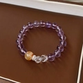 Detail of fluorite and zircon beaded bracelet with natural crystals on a leather stand - 9# Purple Firework Crystal