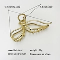 Detailed dimension view of a gold minimalist metal hair claw clip, 10.7cm length - No.19 Gold Large Bow