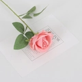 Lifelike pink velvet artificial rose flower with green leaves on a white gift card - Velvet Coral Pink