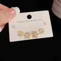 Three-pair gold stud earrings set featuring zircon flower, bow, and square crystal - Gold-Rhinestone Flower Set (79#)