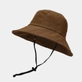 Detail of a brown bucket hat featuring a black adjustable windproof drawstring strap - Brown