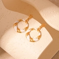 Macro detail of vintage twist hoop earrings with white enamel and golden metallic finish - White Enamel Twisted Round / White (Silver Earring Post)
