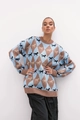 Close-up of color-block knit sweater featuring argyle horse patterns and crew neck design - S / Tan