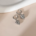 Silver grape-shaped hoop earrings in stainless steel on a minimalist beige background - Steel Color - Grapes Shape