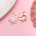 Pink and white enamel fish pendants with golden alloy metal finish and hollow back design - Pink Enamel Ocean Tropical Fish