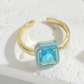 Minimalist adjustable gold ring featuring a square blue zircon and blue enamel accents - Square Blue Gemstone / Lake Blue