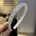 Close-up of elegant baroque silver headband with sparkling crystals and rhinestones - Clear White