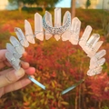 Detail of a Wicca crystal crown with raw stones and a silver crescent moon decoration - White (Silver Moon)