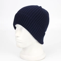 Classic navy blue ribbed knit beanie hat for winter warmth shown on a white mannequin head - One Size / Navy Blue