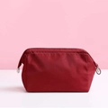 Waterproof nylon cosmetic bag in vibrant red color with secure zipper closure - Burgundy