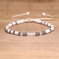 Adjustable woven bracelet featuring white marble beads and pink crystal center stone - No.95 Clear Quartz Cord