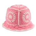 Detailed close-up of handmade crochet flower pattern in pink and cream knitted yarn - Pink
