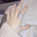 Detailed close-up of a large shield-shaped silver ring with micro-pave crystals on finger - Adjustable Open / Silver Shield Style (6012S)