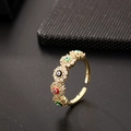 Macro shot of gold open ring featuring colorful evil eye motifs and sparkling zirconias - Five Eyes Colorful (G)