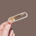 Elegant gold finish hollow oval hair claw clip with sparkling white rhinestones - Gold Rhinestone Style