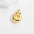 Macro shot of 3D puffy gold letter G pendant with polished metallic bubble texture - Gold-G