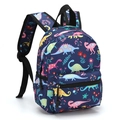 Detail view of the 13 inch blue backpack featuring colorful cartoon dinosaur prints - Dark Blue Dinosaur Flower