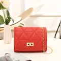 Classic red quilted shoulder bag with gold chain strap and metallic twist lock detail - Red
