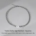 Aquarius zodiac necklace with layered silver chains and blue gemstone pendant - Aquarius