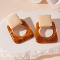 Macro detail of geometric square earrings with amber resin and wood texture finish - Silver Pin-Brown Resin Square (HE24125)