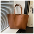Minimalist caramel brown leather tote bag with vertical stitching and handle detail - Brown