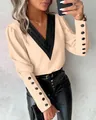 Detail of V-neck beige blouse featuring black contrast collar and buttoned cuffs - S / Tops / Apricot