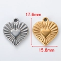 Detailed view of 17.6mm heart pendant charms in gold and silver with ray patterns - Textured Sun Heart