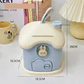 Cute house-shaped piggy bank in cream and blue with a bunny window and top handle - Blue Mushroom House
