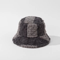 Close-up of thick plush checkerboard bucket hat with grey and black patchwork texture - M (56-58cm) / Gray