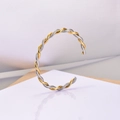 Modieuze C-vormige gedraaide armband van roestvrij staal in goud- en zilverkleur - Goud & Zilver